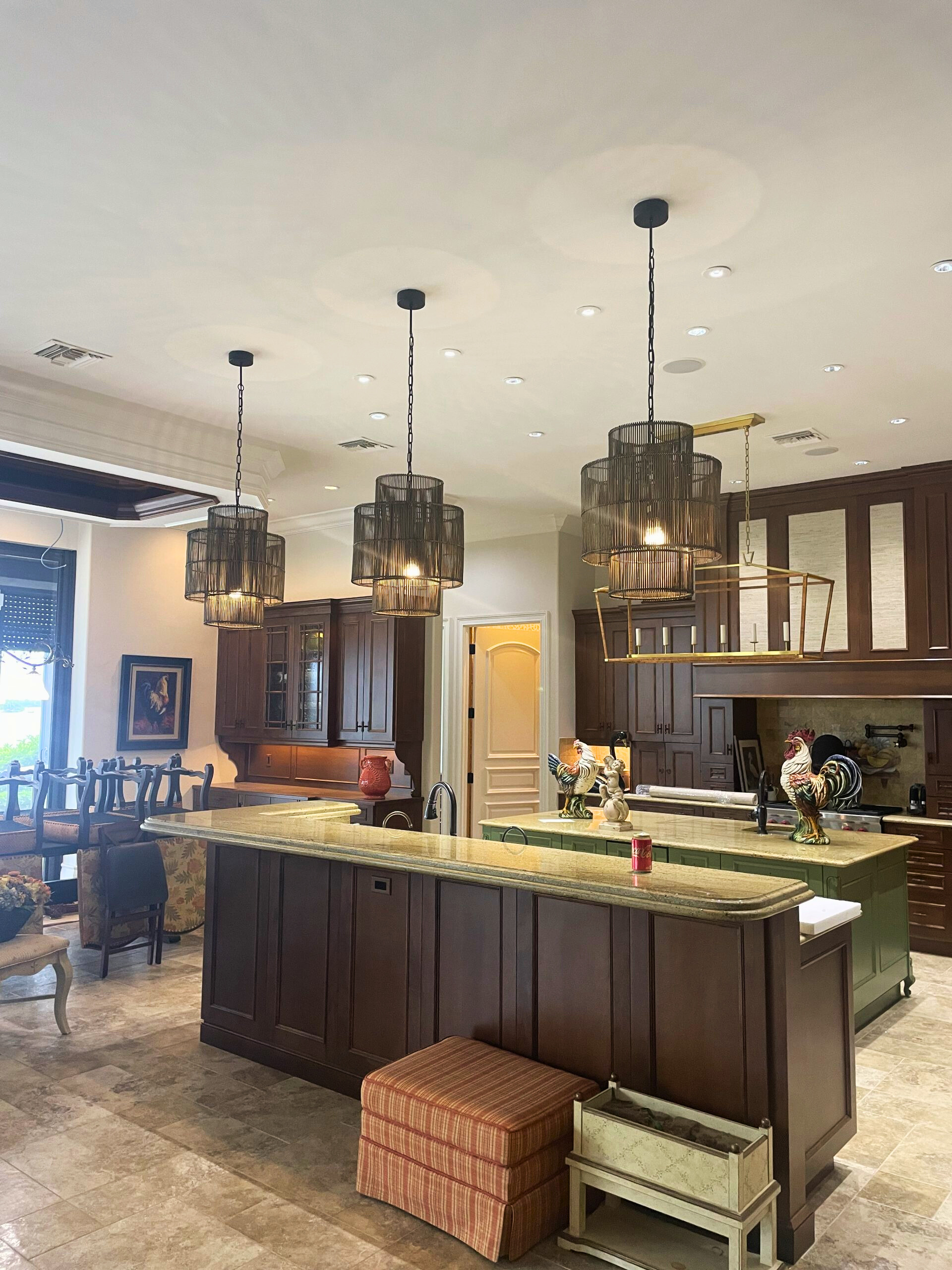 Refinished kitchen cabinets in a Naples, Florida home featuring a modern, updated color palette and smooth professional finish.