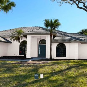 Residential exterior house painted in neutral shades by Creative Colors and Design Naples FL